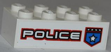 Part 3001pb089R - Brick 2 x 4 with Police White Star Badge and White 'POLICE' with Red Outline Pattern Model Right Side (Sticker) - Set 8301 - De BrickPlaats