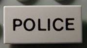 Part 3069pb0001 - Tile 1 x 2 with 'POLICE' Pattern - De BrickPlaats