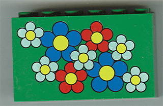 Part 6213pb01 - Brick 2 x 6 x 3 with Blue, Red, and White Flowers with Yellow Centers Pattern - De BrickPlaats