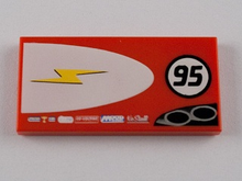 Part 87079pb0029L - Tile 2 x 4 with Lightning Bolt in Half Ellipse and '95' Pattern Model Left Side - De BrickPlaats