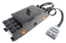 Part 87574c01 - Electric, Train Motor 9V RC Train with Integrated PF Attachment, Orange Wheel Holders - De BrickPlaats