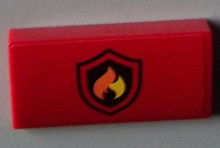 Part 88930pb027 - Slope, Curved 2 x 4 x 2/3 with Bottom Tubes with Black and Yellow Fire Logo Badge Pattern (Sticker) - Set 60003 - De BrickPlaats